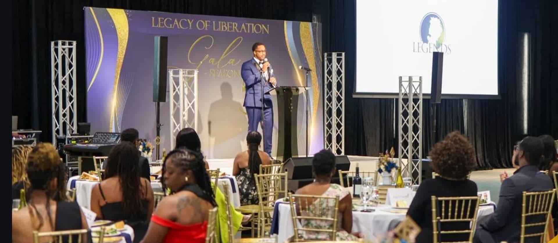 Speaker on stage at the 2025 Legacy of Liberation Gala
